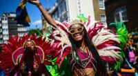 Notting Hill Carnival, the largest street party in Europe, officially begun on Sunday morning with dancers in bright costumes parading along the streets