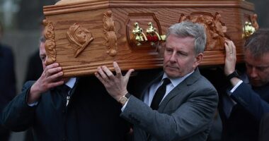 Patrick looked bereft as he carried Mary's coffin through his home village, where he was joined by close family and friends at the Church of the Sacred Heart