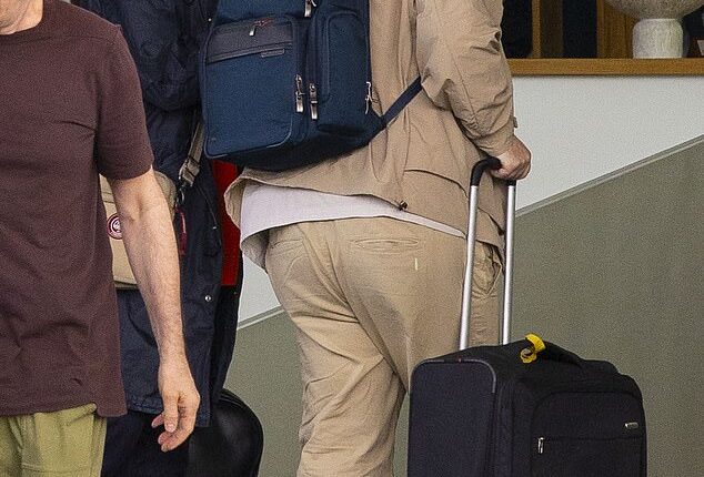 The brotherly bond was well in evidence on Friday as Paul Gallagher joined supportive younger brother Liam at Luton airport - just weeks ahead of his scheduled court appearance