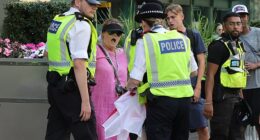 'Pink Lady' anti-migrant protesters have clashed with police outside a hotel housing asylum seekers in Canary Wharf today in the latest wave of demonstrations