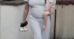 Pregnant Katherine Ryan showed off her growing baby bump as she headed out with her daughter on Friday