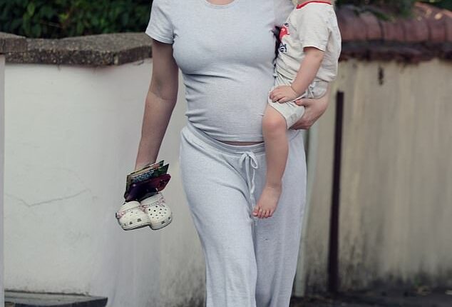 Pregnant Katherine Ryan showed off her growing baby bump as she headed out with her daughter on Friday