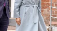 Queen Camilla (pictured) looked typically elegant in a pale blue coat and wide-brimmed cream hat complete with a bow