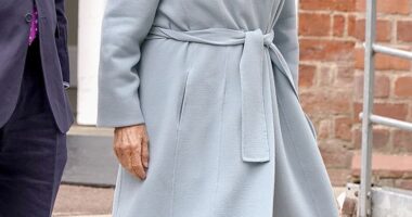 Queen Camilla (pictured) looked typically elegant in a pale blue coat and wide-brimmed cream hat complete with a bow