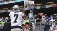 Las Vegas Raiders quarterback Geno Smith responds to a Seattle Seahawks fan