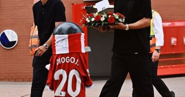 Man United captain Bruno Fernandes (left) and defender Diogo Dalot (right) pictured outside Anfield last month to pay tribute to Portugal team-mate Diogo Jota following his tragic death