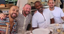 Rochelle Humes has raised eyebrows after sharing a photo of Myleene Klass' ex-husband Graham Quinn (centre left) posing with her husband Marvin (left) in Ibiza on Monday
