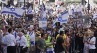 Scuffles have reportedly broken out during a protest calling on the government to do more to free Israeli hostages held captive by Hamas (pictured are some of the campaigners today)