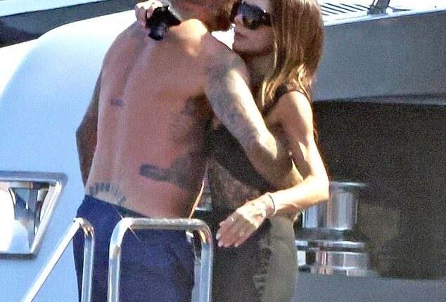 David Beckham was seen squeezing wife Victoria's bottom yet again as they continued their sun-soaked family getaway off the Italian coast on Thursday