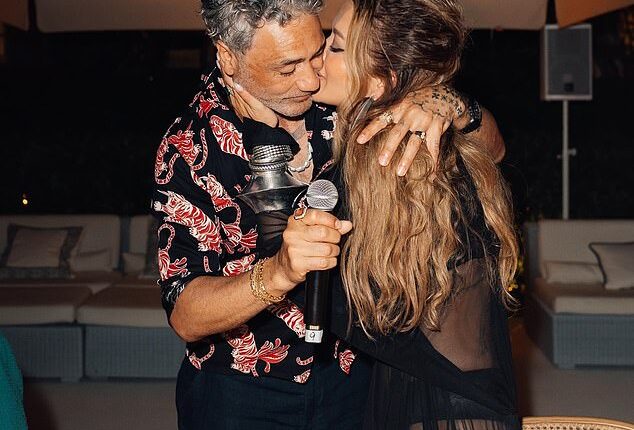 Taika Waititi was on cloud nine as he celebrated his 50th birthday with his wife Rita Ora and a host of celebrity friends in Ibiza on Monday