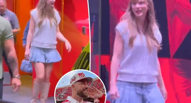 Taylor Swift pairs her new engagement ring with a pleated skirt at Nebraska vs. Cincinnati game