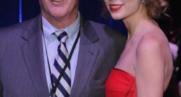 Taylor Swift's triumphant appearance on her boyfriend Travis Kelce's podcast took a somber turn as she shared a health update on her father Scott after he underwent 'intense' heart surgery; seen together in 2011 in Nashville, Tennessee