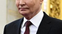 A frontal view of Putin's face at a ceremony in 2024