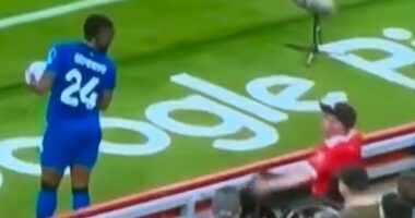 A Liverpool fan appears to have an exchange with Bournemouth winger Antoine Semenyo during the team's Premier League match on Friday