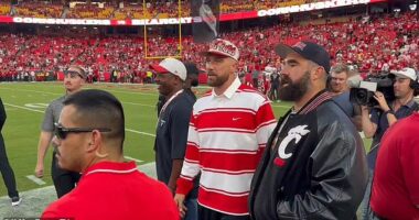 Flying solo without his new fiancee , Travis was joined by another former Bearcat, his brother Jason, on the sideline ahead of Thursday's season opener
