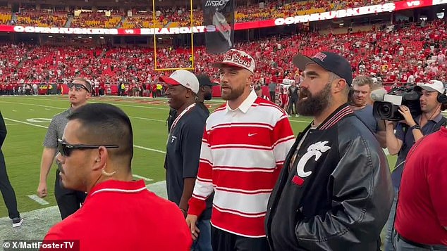 Flying solo without his new fiancee , Travis was joined by another former Bearcat, his brother Jason, on the sideline ahead of Thursday's season opener