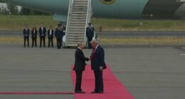 Trump Greets Putin in Alaska.