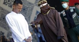 Two gay men grimaced in agony as they were brutally whipped in public over their same-sex relations in Aceh, Indonesia