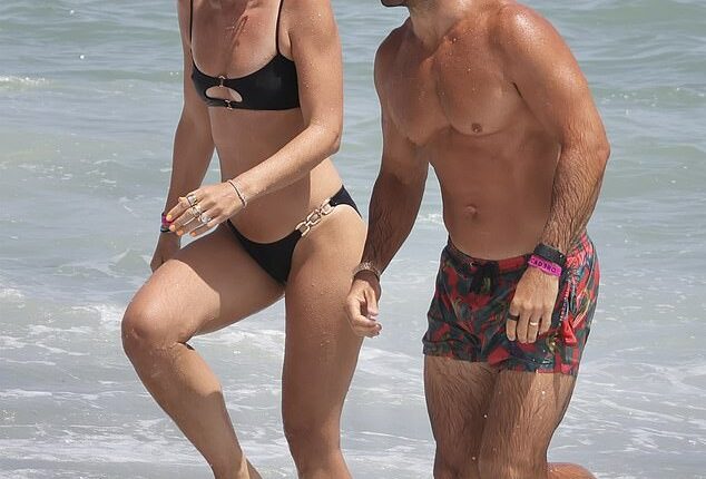 Vogue Williams showed off her toned figure as she packed on the PDA with her husband Spencer Matthews in Spain on Monday