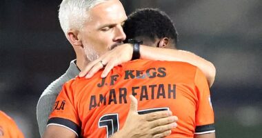 Jim Goodwin consoles Amar Fatah after his missed penalty in the Tannadice shootout