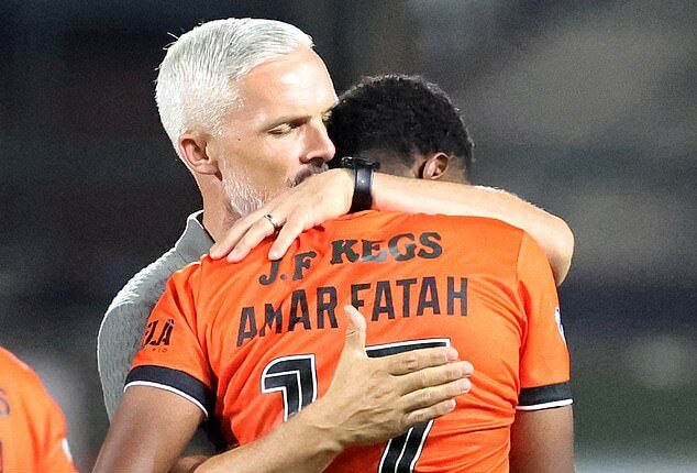 Jim Goodwin consoles Amar Fatah after his missed penalty in the Tannadice shootout