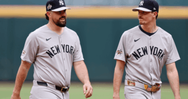 Yankees starters Max Fried and Carlos Rodón walking together on the field, both struggling to pitch deep into games during the team’s slump.