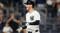 Cody Bellinger in Yankees pinstripes swings during a 2025 game, delivering another key hit in a breakout season.
