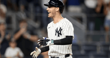 Cody Bellinger in Yankees pinstripes swings during a 2025 game, delivering another key hit in a breakout season.