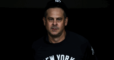 Yankees manager Aaron Boone walks off the field after another costly bullpen decision by sending Devin Williams in extra innings against the Astros.