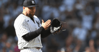 David Bednar pitches in the Yankees’ win over the Astros, working a rare five-out save opportunity as manager Aaron Boone looks on.
