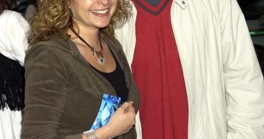 Alan Davies has spoken about the impact his father's abuse has had on his romantic relationships and how his ex-girlfriend Julia Sawalha (pictured together in 2003) branded him a 'c***' before flying home early from a trip together