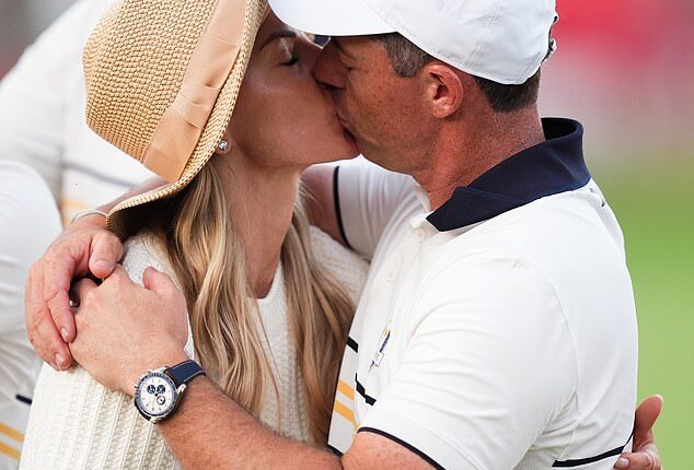 At the end of an emotional week, Rory McIlroy kisses his wife Erica at the Ryder Cup where Europe beat the US 15-13 on yet another extraordinary day of golf
