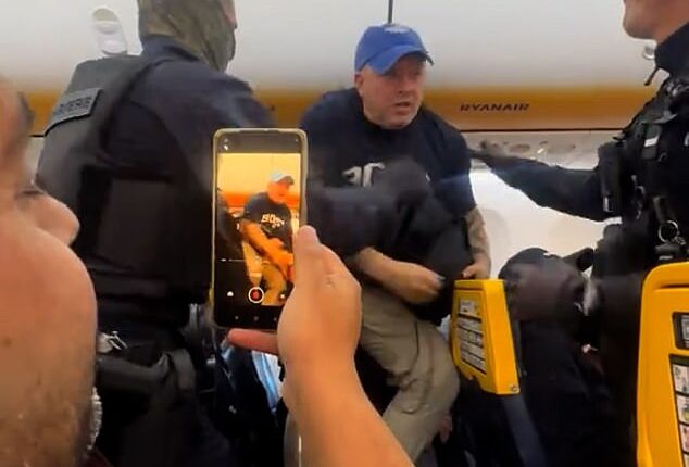 Chaotic footage shared on social media captured the scenes on board the flight which saw officers storming on to the plane
