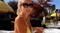 Amanda Holden put on a cheeky display as she showcased her sensational figure in a yellow bikini while relaxing in her hot tub on Instagram on Monday