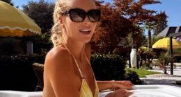 Amanda Holden put on a cheeky display as she showcased her sensational figure in a yellow bikini while relaxing in her hot tub on Instagram on Monday