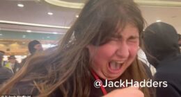 One woman reeling away in agony after being caught by the pepper spray