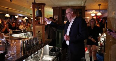 Albanese rang the iconic Bells Beach trophy which, in Old Mate's pub tradition meant patrons would receive a drink on the house (pictured)