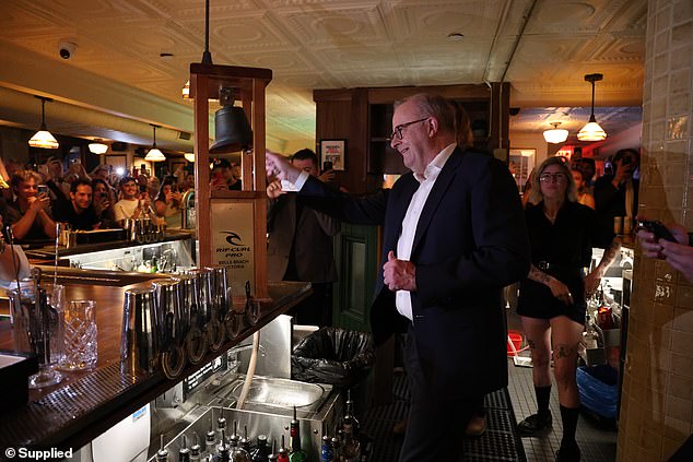 Albanese rang the iconic Bells Beach trophy which, in Old Mate's pub tradition meant patrons would receive a drink on the house (pictured)