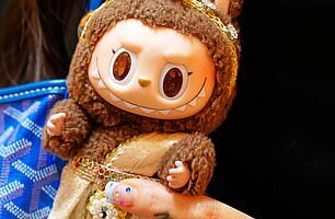 Genuine Labubu dolls from Pop Mart have a distinctive elf-like design and include authenticity markers