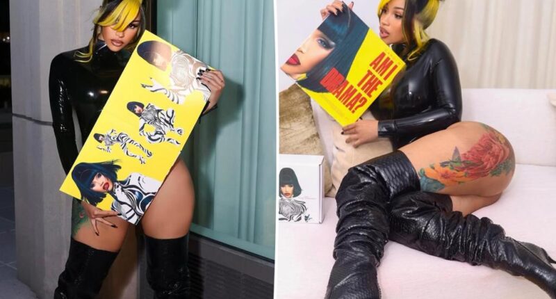 Cardi B flashes her butt in vinyl bodysuit, $1,500 thigh-high boots