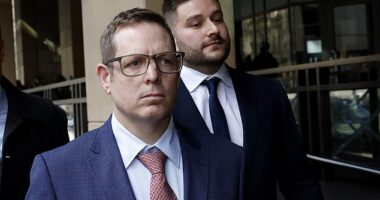 Sergeant James Fitzgerald (front) and Constable Alexander Papanastassis leave the Melbourne Magistrates' Court on Friday