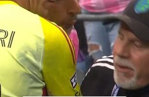 Luis Suarez appeared to spit on a rival coach