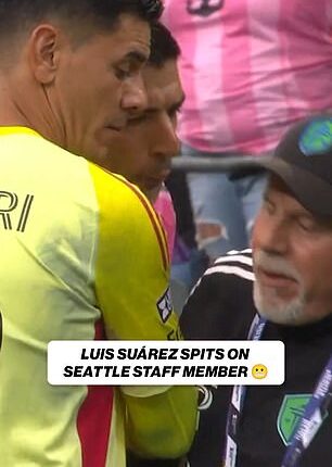 Luis Suarez appeared to spit on a rival coach