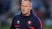 Cheltenham Town have sacked manager Michael Flynn after a dreadful start to the season