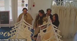 This is the moment a gang of smirking women brazenly snatch multiple wedding dresses from a bridal shop worth a total of over £4,000 in a daylight robbery