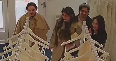 This is the moment a gang of smirking women brazenly snatch multiple wedding dresses from a bridal shop worth a total of over £4,000 in a daylight robbery