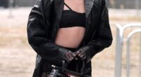 Clara McGregor flashed her abs in a skimpy black bra and a leather trench as she led the front row at Antonio Marras' Spring/Summer 2026 show during Milan Fashion Week on Wednesday