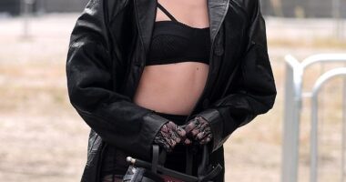 Clara McGregor flashed her abs in a skimpy black bra and a leather trench as she led the front row at Antonio Marras' Spring/Summer 2026 show during Milan Fashion Week on Wednesday