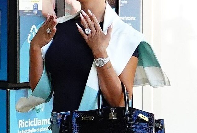 Cristiano Ronaldo 's fiancée Georgina Rodriguez was seen departing Venice on Monday, while once again flashing her $3m (£2.2m) engagement ring.