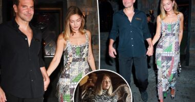 Gigi Hadid holds hands with Bradley Cooper as they celebrate her Vogue cover in NYC